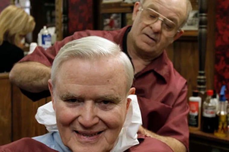 At Bob Burton&#0039;s Barber Shop , Benn Lacorte gives Bud Pierce of Centerville, Del., a trim.