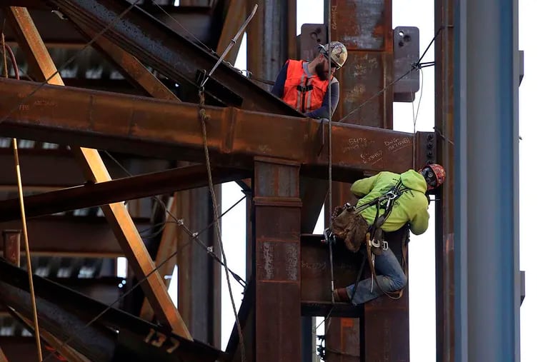 Ironworkers help to build the new Comcast Innovation and Technology Center in Philadelphia.