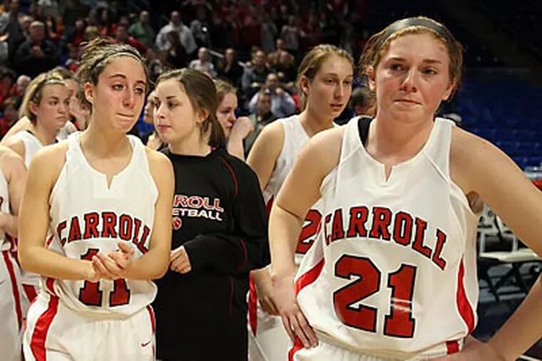 Archbishop Carroll girls react after losing by one point in the class AAAA state championship. (Steven M. Falk/Staff Photographer)