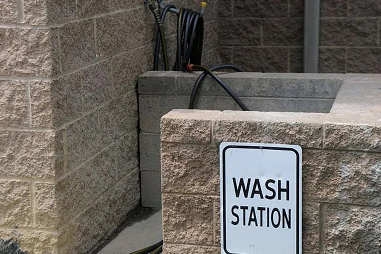 Marcellus Shale workers can wash off their boots and gear outside the hotels. ANNA BENTLEY / Pittsburgh Post-Gazette