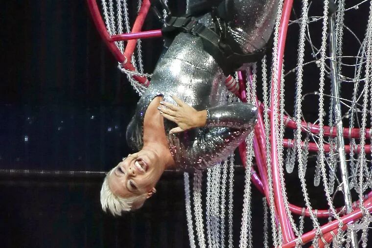 Pink, the Doylestown bred pop star born Alecia Moore, looks like she may be trying to prevent a wardrobe malfunction as she swings upside down from the chandelier while performing at the Wells Fargo Center in South Philly on April 13, 2018. It was her first hometown show since the release of her Beautiful Trauma album in the fall.