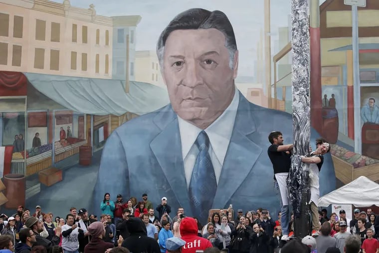 The mural of former Mayor Frank Rizzo looms over festivities at the Ninth Street Italian Market.