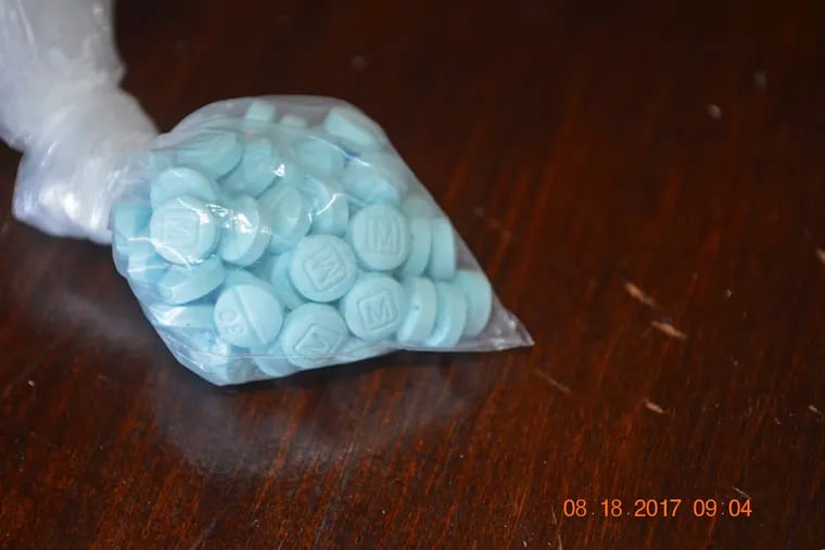 This photo provided by the U.S. Drug Enforcement Administration's Phoenix Division shows a closeup of fentanyl-laced pills that mimic prescription oxycodone.