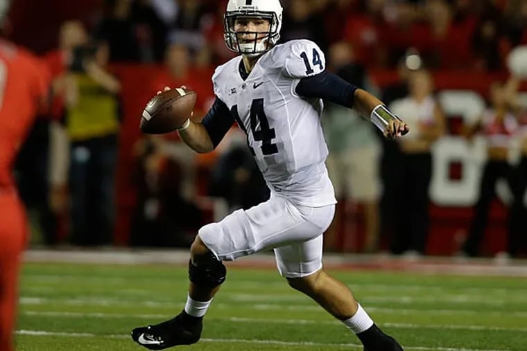 Penn State quarterback Christian Hackenberg (14) scrambles as he looks
to throw a pass during the first quarter of an NCAA college football
game against Rutgers, Saturday, Sept. 13, 2014, in Piscataway, N.J.
(Mel Evans/AP)