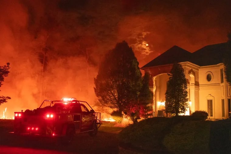 The so-called Flatiron Wildfire in Medford, N.J., encompassed 120 acres and was threatening 40 homes Saturday, June 3, 2023, officials said.