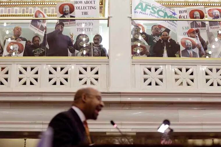 Mayor Michael Nutter attempts to delivers his budget address to city council at City Hall, Thursday, March 14, 2013, in Philadelphia. Deafening protests have forced Philadelphia Mayor Michael Nutter to abandon his traditional budget address in mid-speech. (AP Photo/Matt Rourke)
