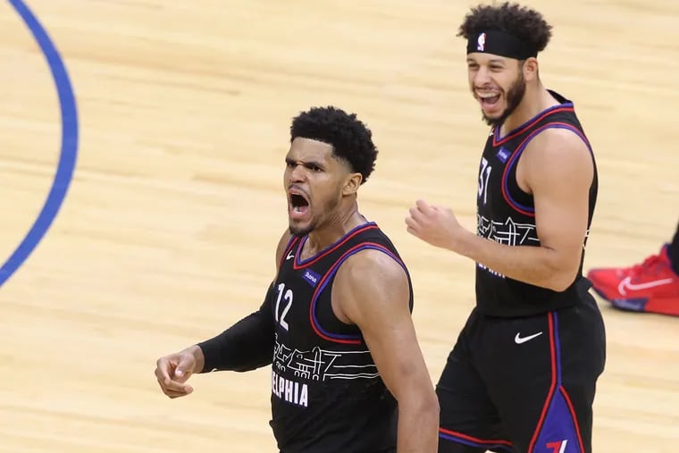 Tobias Harris, left, and Seth Curry of the Sixers celebrate after Harris yells "I'm an All-Star" following a clutch basket against the Knicks during the fouth quarter of Tuesday night's game at the Wells Fargo Center.
