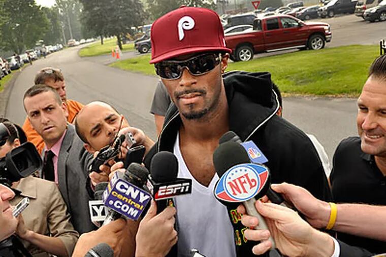 Plaxico Burress' Phillies cap was impossible to miss when he came out of prison in Rome, N.Y. (Heather Ainsworth/AP)