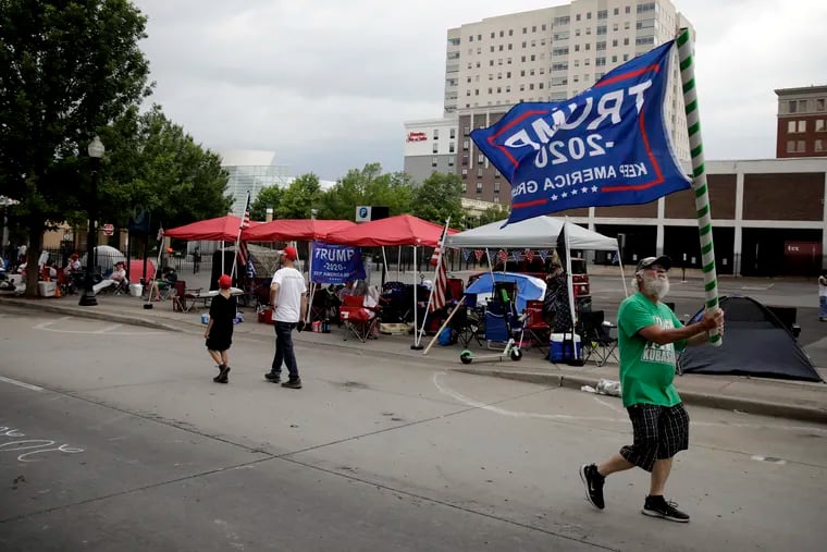 A gathering of Trump supporters on 4th Street and Cheyenne Ave. in downtown Tulsa, Okla., ahead of President Donald Trump's campaign rally in the city on Saturday.