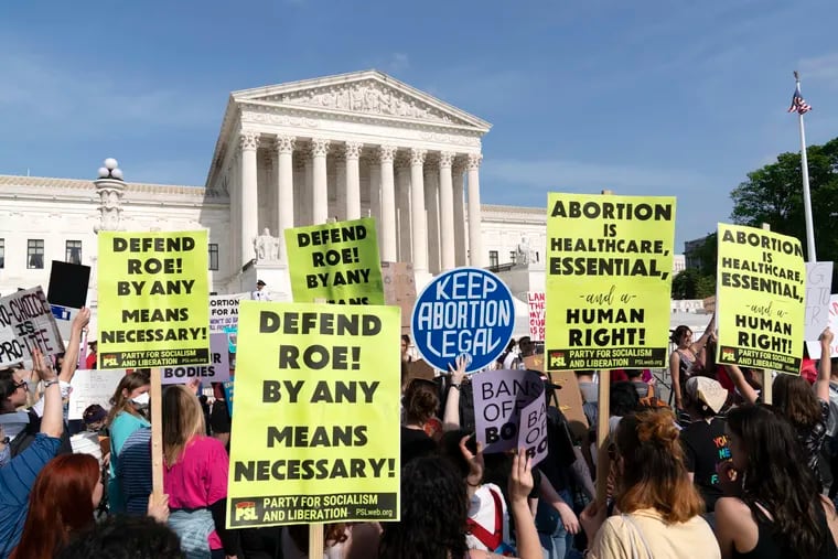 Demonstrators protesting outside of the U.S. Supreme Court on Tuesday.