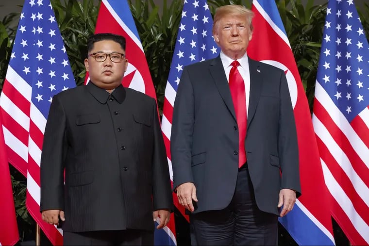 In this June. 12, 2018, file photo, U.S. President Trump, right, stands with North Korean leader Kim Jong Un on Sentosa Island in Singapore.