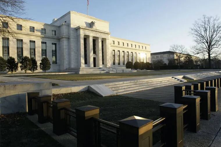 FILE - This Jab. 14, 2010 file photo shows the Federal Reserve Building in Washington. When the Federal Reserve offers its latest word on interest rates this week, few think it will telegraph the one thing investors have been most eager to know: When it will slow its bond purchases, which have kept long-term borrowing rates low.  (AP Photo/Alex Brandon, File)