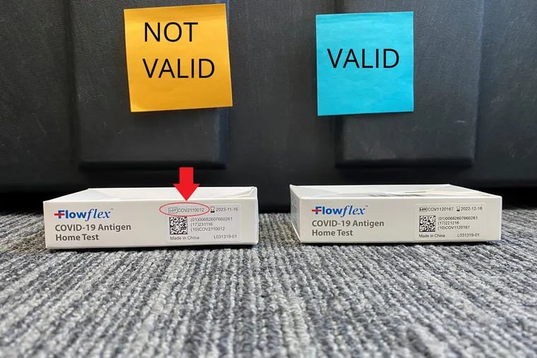 An invalid Flowflex COVID-19 rapid test, with a false lot number, is shown next to a valid test. Philadelphia's health department is recalling thousands of the invalid tests after discovering they were not made by Flowflex's manufacturer.