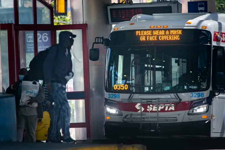 A SEPTA bus stopped at the Olney Station at North Broad and Olney Streets has a marquis that reads "Please Wear a Mask or Face Covering," informing riders to cover up during COVID-19 pandemic.