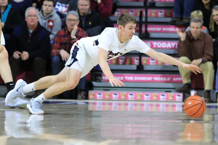 Ryan Betley of Penn dives for a loose ball against Princeton during the 2nd half at the Palestra on Jan 6, 2018.