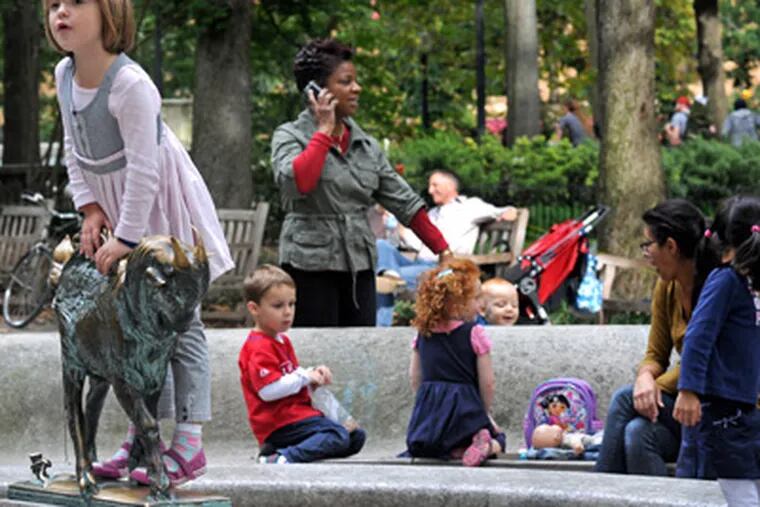 In Rittenhouse Square, children gather to play on a sunny afternoon. (April Saul / Staff Photographer)