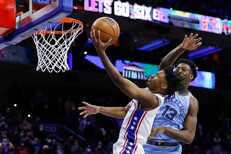 Sixers guard Tyrese Maxey lays up the go-ahead basket past Memphis Grizzlies forward Jaren Jackson Jr. late in overtime.