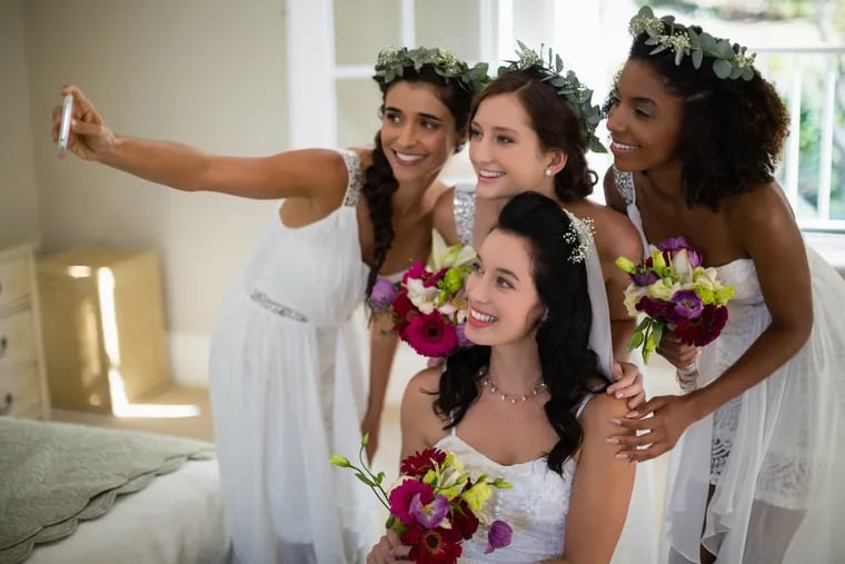 Wedding party members on average spent $1,430 last year to be a part of a close friend or family member's wedding, according to wedding planning site The Knot.