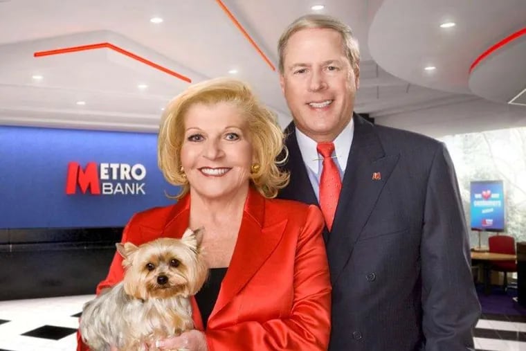 Vernon W. Hill II, his wife, Shirley Hill, and their dog, Duffy, fund-raising for the British bank he founded in the early 2010s. They are accused of mismanaging a profit-sharing plan by investing most of its money in Hill's banks, which lost most of their value, costing the plan millions.