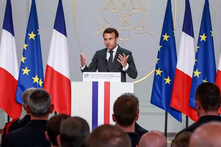 French President Emmanuel Macron addresses Paris Firefighters' brigade and security forces who took part at the fire extinguishing operations of the Notre Dame of Paris Cathedral fire, at the Elysee Palace in Paris, Thursday, April 18, 2019. France paid a daylong tribute Thursday to the Paris firefighters who saved the internationally revered Notre Dame Cathedral from collapse and rescued many of its treasures.
