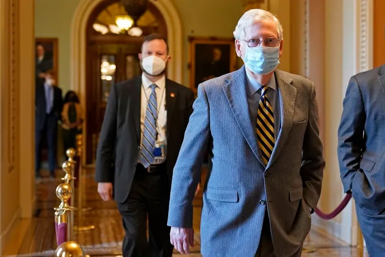 Senate Majority Leader Mitch McConnell of Ky., walks back to his office on Capitol Hill in Washington, Wednesday, Dec. 30, 2020.