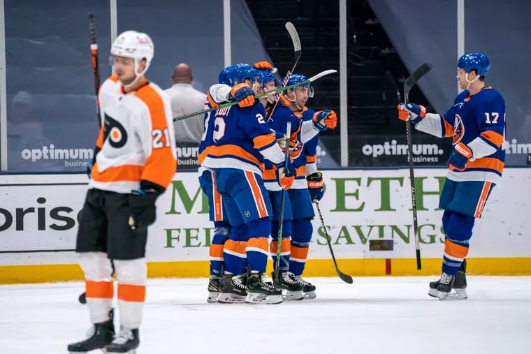 Scott Laughton skates away as the Islanders celebrate Anthony Beauvillier's first-period goal.