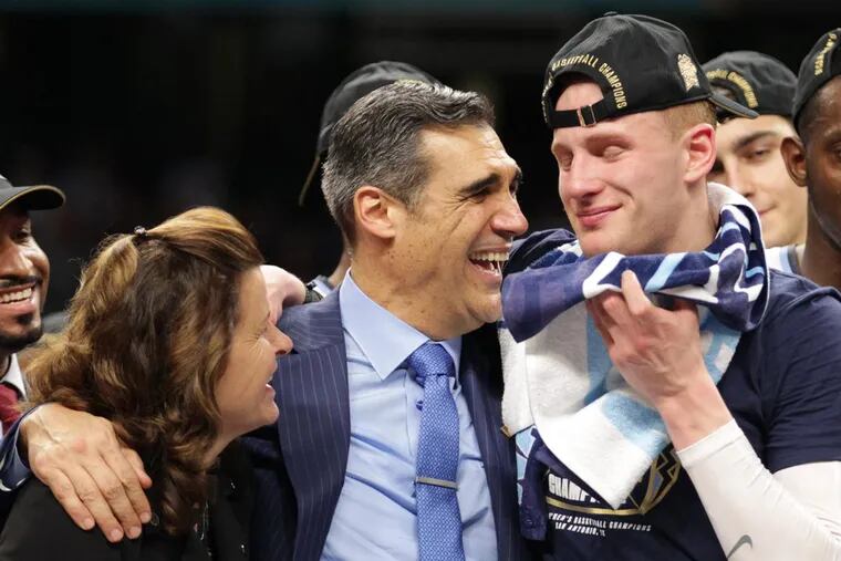 Villanova coach Jay Wright, center, and wife Patricia spend a moment with an emotional Donte DiVincenzo after winning NCAA championship at the Alamodome.