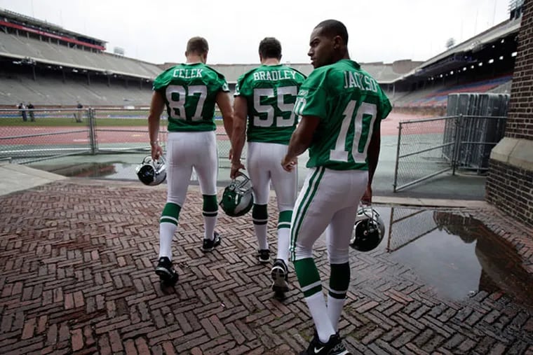 Brent Celek, left, Stewart Bradley, center, and DeSean Jackson wear throw-back kelly green uniforms at Franklin Field in 2010.