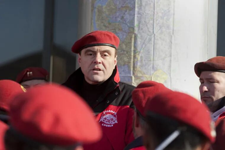 Guardian Angels founder Curtis Sliwa addresses his assembled members outside of the Walter Rand Transportation Center at Broadway and Martin Luther King Blvd. (Ed Hille / Staff Photographer)