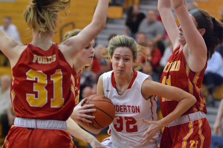 Souderton’s Kate Connolly (32) drives between a pair of Haverford High defenders in a District 1 Class 6A second-round win on Wednesday.