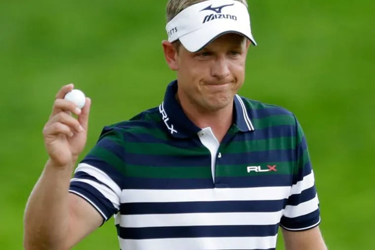 Luke Donald reacts after a putt on the fourth green during the first round of the U.S. Open golf tournament at Merion Golf Club, Thursday, June 13, 2013, in Ardmore, Pa. (Gene J. Puskar/AP)