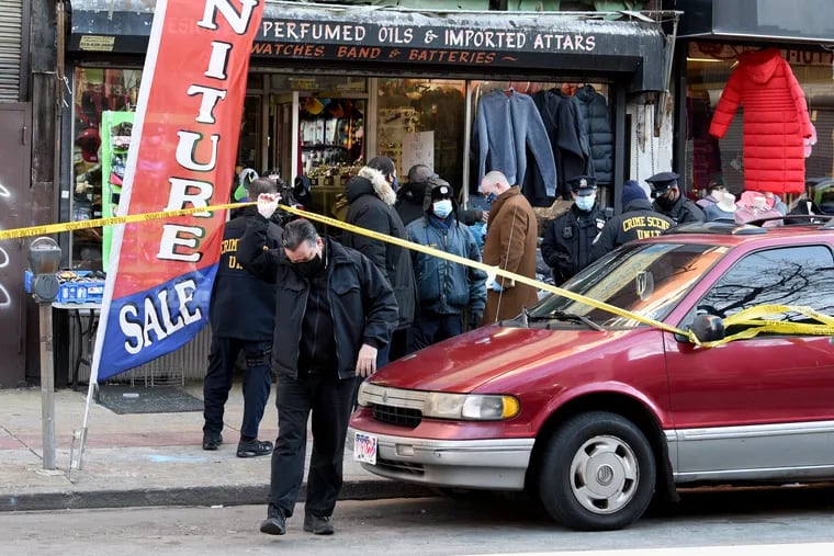 Police investigators are on the scene after two people were found shot and killed inside the Al-Madinah Traders store.