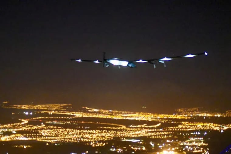 The Solar Impulse 2 approaches the airport. The plane's wings were equipped with 17,000 solar cells that charged batteries. Stored energy was used at night.