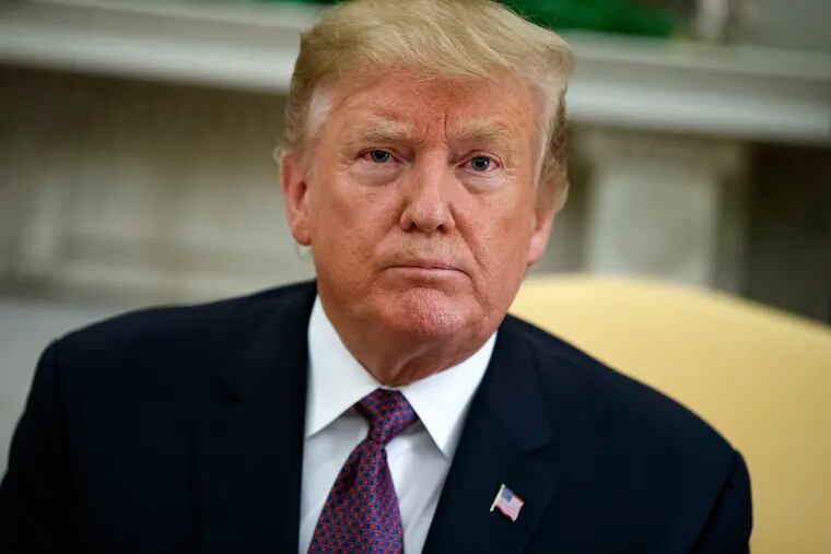 In this May 13, 2019, photo, President Donald Trump listens to a question during a meeting with Hungarian Prime Minister Viktor Orbán in the Oval Office of the White House in Washington. A federal judge in Washington is set to hold a hearing on May 14 on Trump’s attempt to block a House subpoena seeking his financial records.