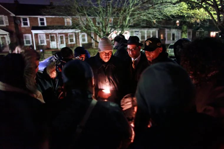 Friends and family members gather in a prayer circle during a candlelight vigil for Shalamar Longer on Thursday Feb. 11, 2016, in Chester.