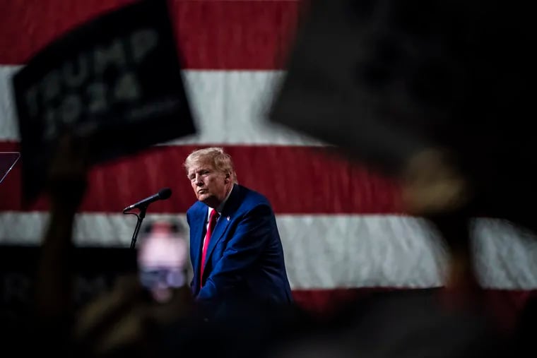 Donald Trump at a campaign event in Reno, Nev., in December. The former president must be held accountable for his assault on our nation’s most fundamental principles, writes former Rep. Jim Greenwood.