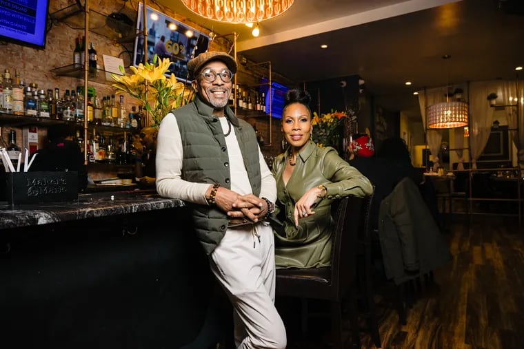 Tracey and Cheri Syphax at Booker's on Baltimore Avenue. The Syphaxes bought Booker's and the Bayou Lounge in early March from former owner Saba Tedla.