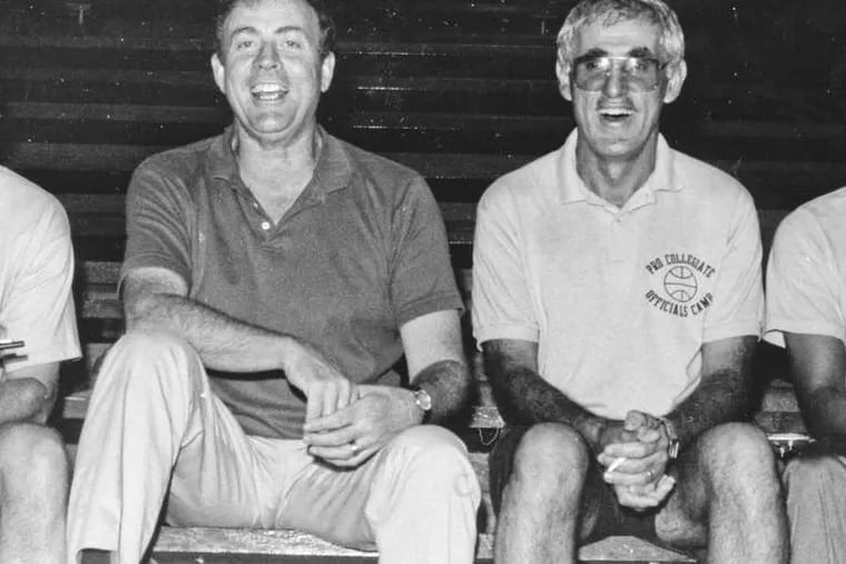 Earl Strom (right) sits with fellow NBA ref Hank Nichols.