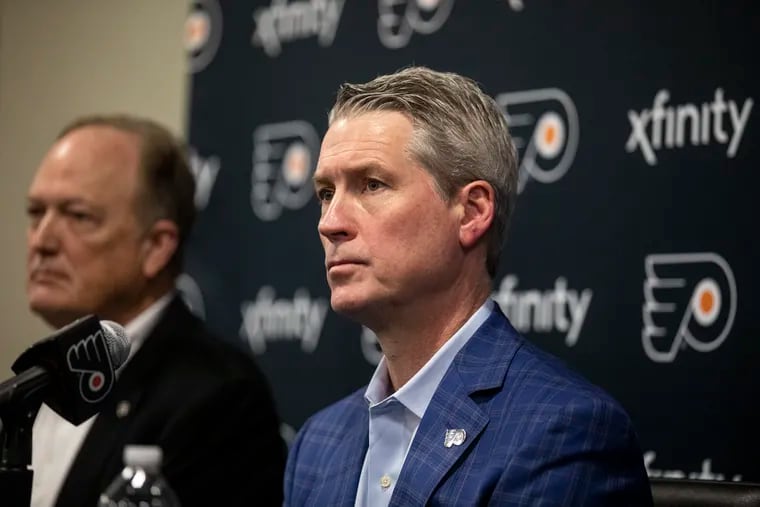 Flyers general manager Chuck Fletcher (right) believes the organization needs to "aggressively retool" during this offseason.