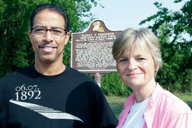 Keith Plessy and Phoebe Ferguson, descendants of the principals in the Plessy v. Ferguson court case, posed for a photograph in front of a historical marker in New Orleans on June 7, 2011.