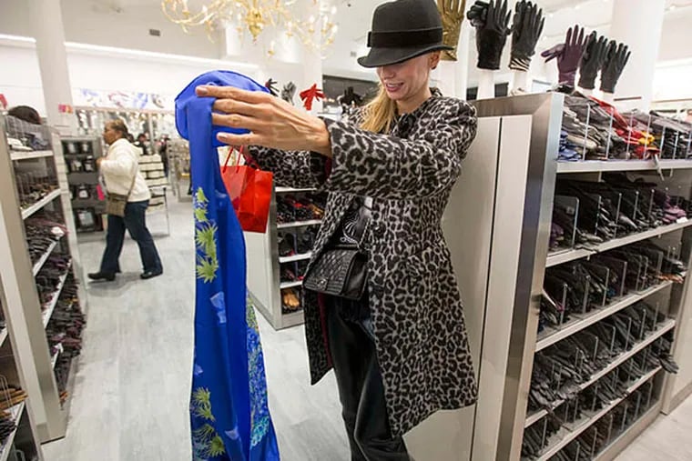 Sonia Mignini looks at a scarf at the new Century 21 on Market Street, which had a &quot;soft launch&quot; opening.