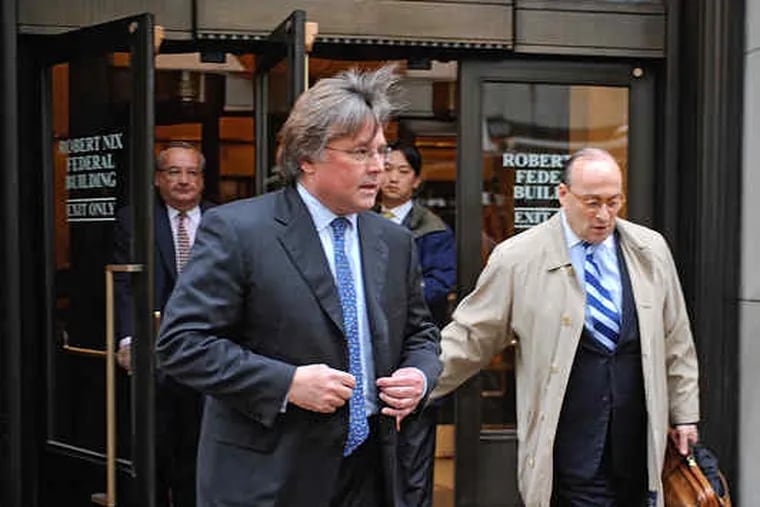 Philadelphia Media Holdings CEO and publisher Brian Tierney (foreground) leaves the Robert Nix Federal Building after a bankruptcy hearing yesterday on the fate of his company. An auction for the company is scheduled for today in New York City. With Tierney are (from left) Richard Thayer, chief financial officer of PMH; Phil Kwun, a financial analyst with Sonenshine Partners, and Marshall Sonenshine, head of Sonenshine Partners, financial advisers to the company.