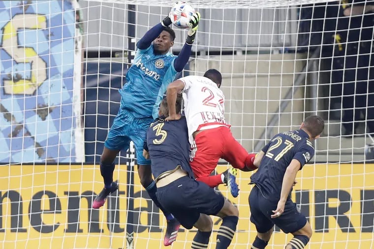 Jack Elliott (center) got in a big collision with Union goalkeeper Andre Blake (left) and the Red Bulls' Cristian Cásseres Jr. in the third minute of Saturday's game.