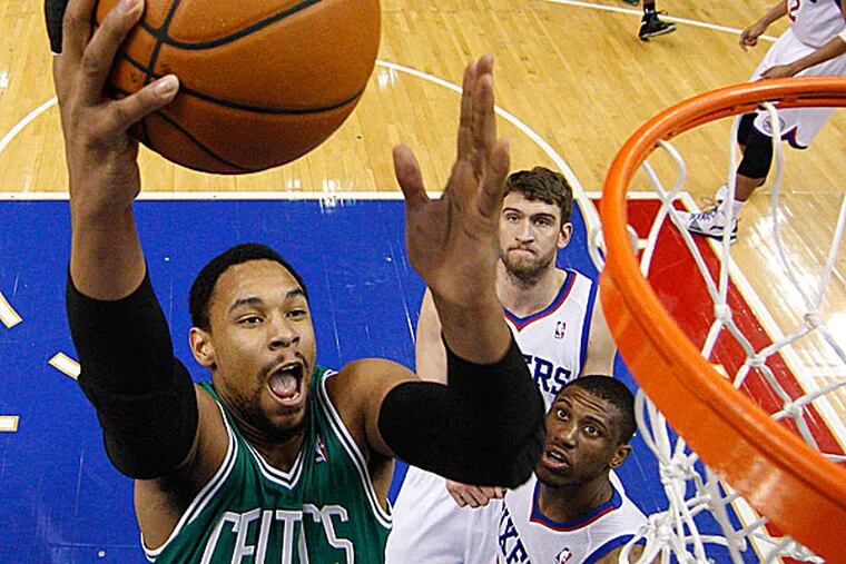 The Celtics' Jared Sullinger goes up for the shot as the 76ers’ Thaddeus Young and Spencer Hawes watch. (Chris Szagola/AP)