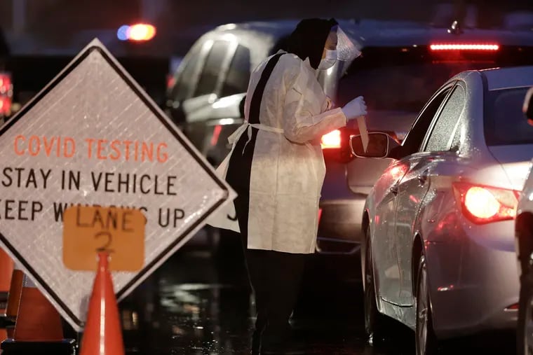 Cars waited in line at Gloucester County's drive-through COVID-19 testing site on Thursday.