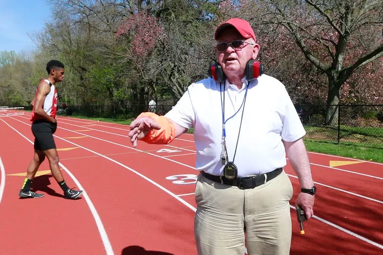 Archbishop Ryan track and field coach Ed Ulmer resorts to starting a meet himself as he is the only one who brought a starting pistol to a Father Judge track meet Monday April 18, 2016. ( DAVID SWANSON / Staff Photographer )