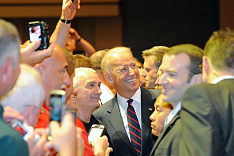 Vice President Biden (center) mingles with firefighters after speaking at the International Association of Fire Fighters' gathering at the Convention Center. CLEM MURRAY / Staff Photographer