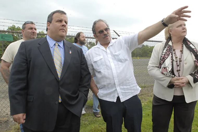 N.J. GOP gubernatorial candidate Christopher J. Christie hears from laid-off worker Al Ashinoff outside the closed Griffin Pipe foundry in Florence. Sen. Diane Allen (R., Burlington) is at right. (April Saul / Staff Photographer)