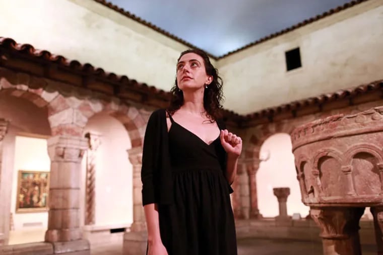 Actress Felicia Leicht in the Cloister at the Art Museum, one setting of "Five Kings."