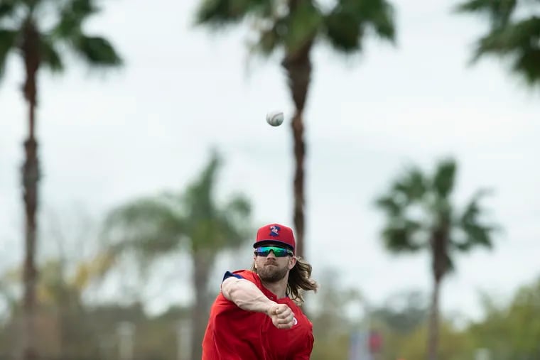 Phillies, Bryce Harper throws the baseball during spring training practice in Clearwater, FL on February 19, 2020.